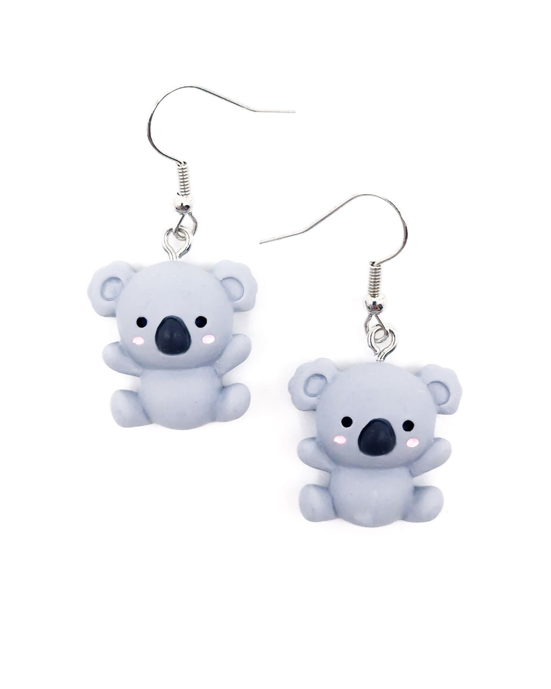 Front view of cute grey koala dangle earrings with pink cheeks and silver hooks on a white background.