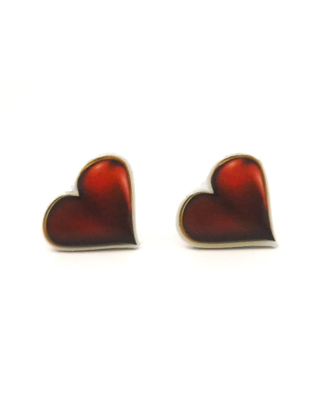 Shiny red heart stud earrings with glossy heart charms on a white background