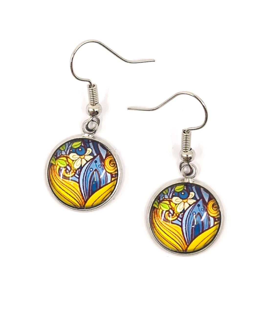 Round patterned earrings with blue and yellow leafy floral design under smooth glass on silver hooks