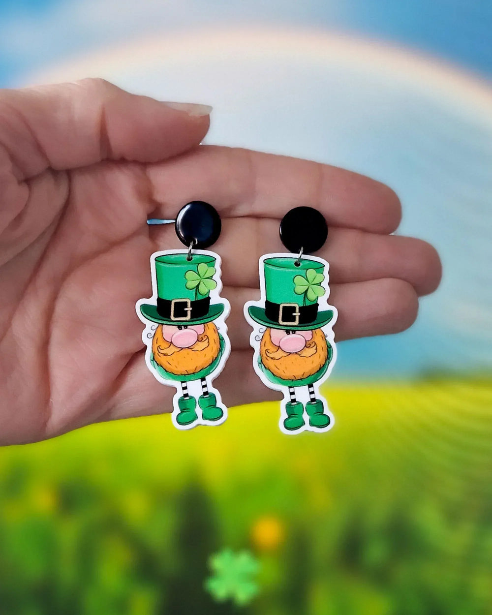 Lucky Leprechaun drop earrings held in hand, showing size and playful St Patrick’s Day design