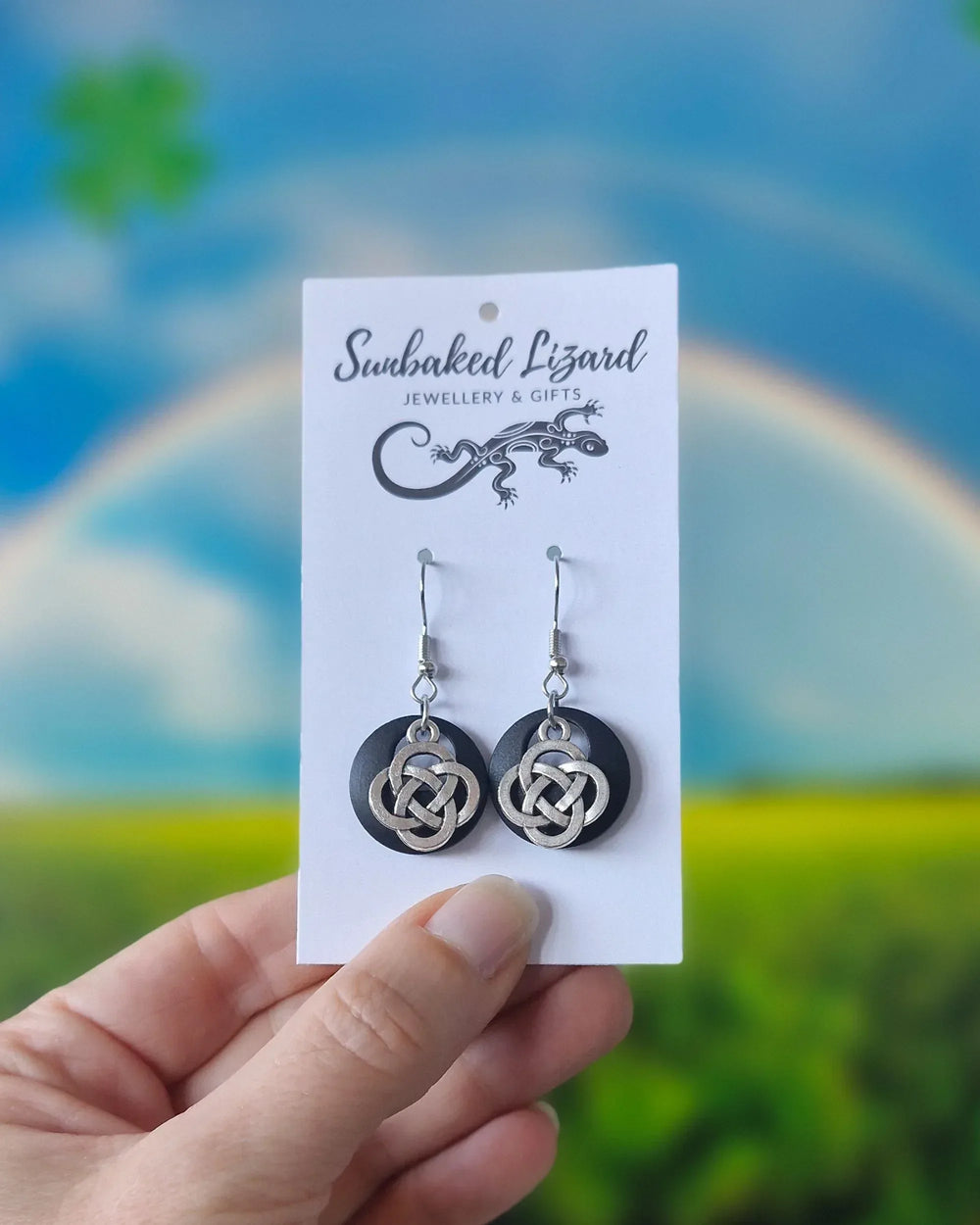 Celtic knot earrings displayed on Sunbaked Lizard card