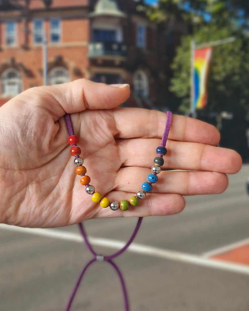Rainbow Pride necklace with colourful ceramic beads on adjustable faux leather cord