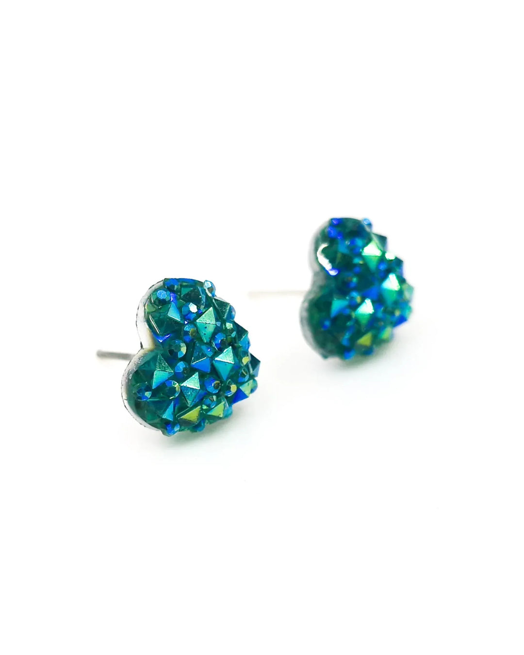 Close up of sparkly heart shaped earrings in blue