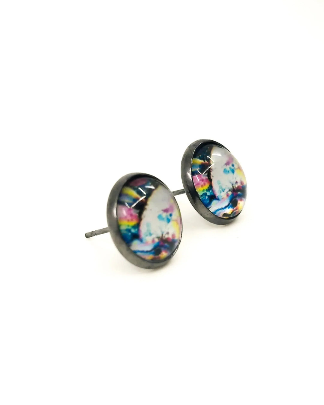 Close-up of abstract rainbow stud earrings showing colour detail