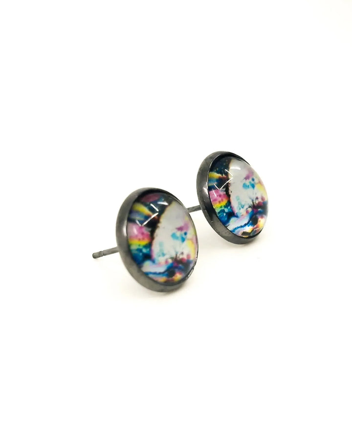 Close-up of abstract rainbow stud earrings showing colour detail