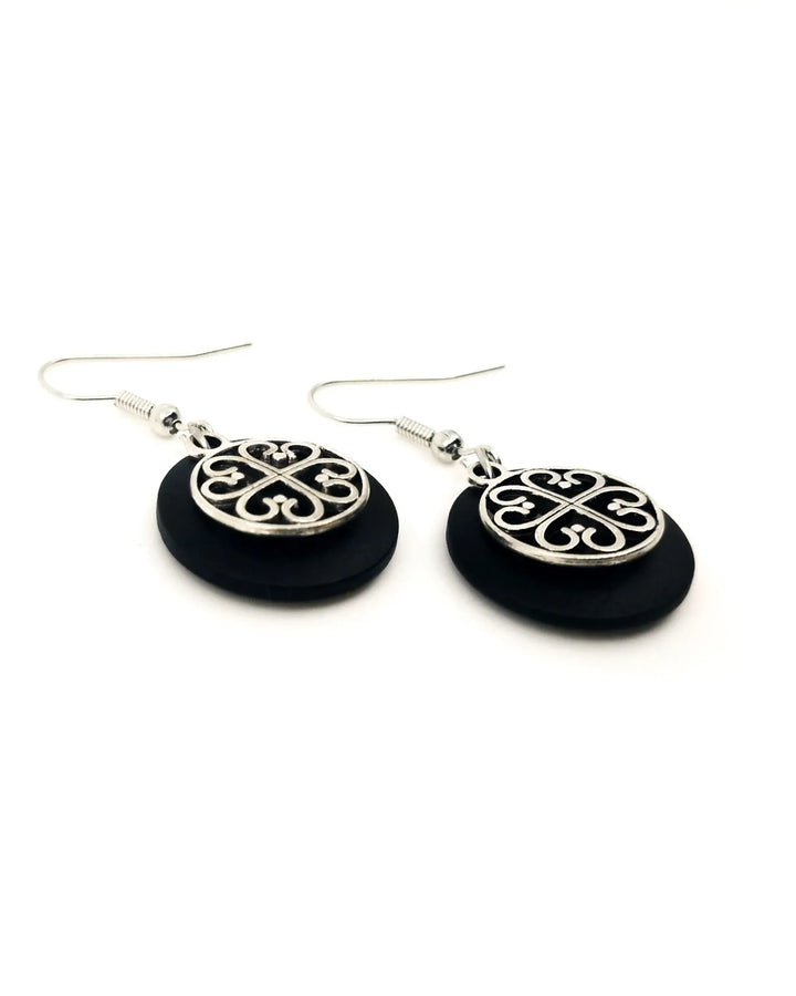 Close-up of black Circle of Hearts earrings showing heart charm details
