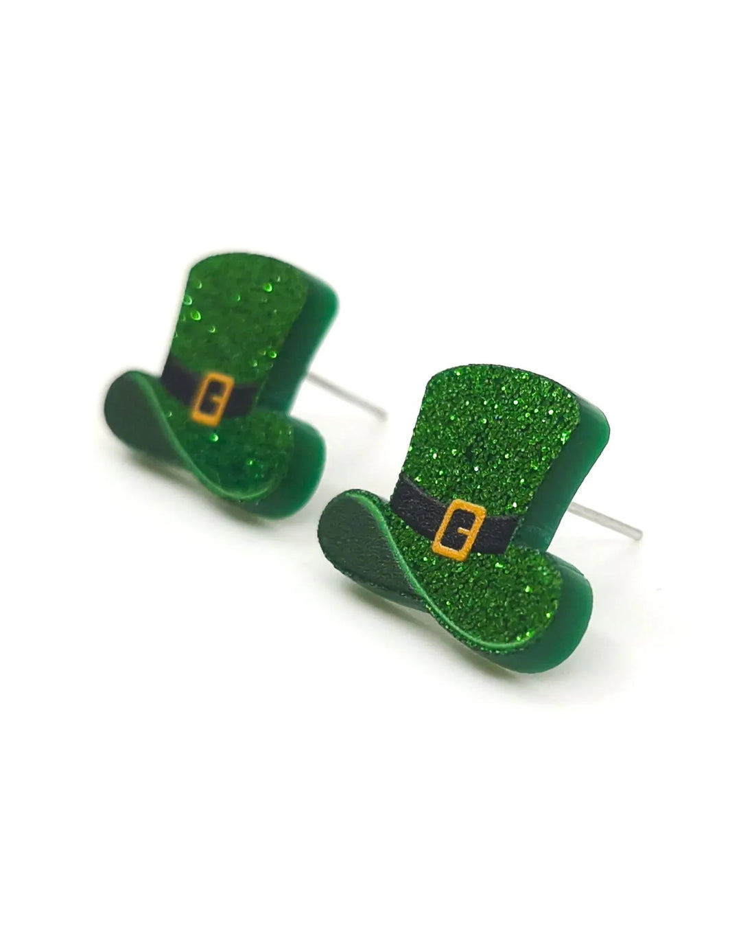Close-up of green glitter leprechaun hat stud earrings with buckle detail