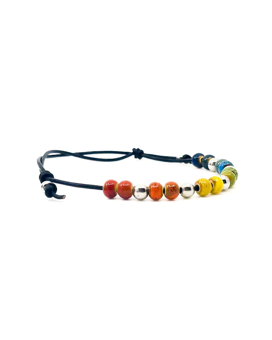 Close-up of rainbow ceramic beads on Rainbow Pride anklet