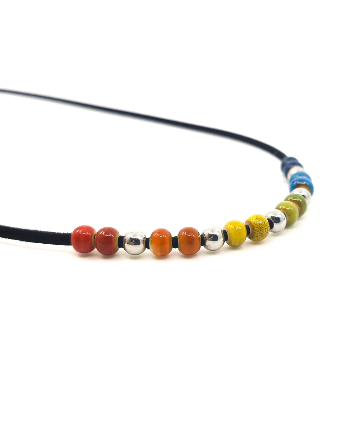 Close-up of rainbow ceramic beads on Rainbow Pride necklace