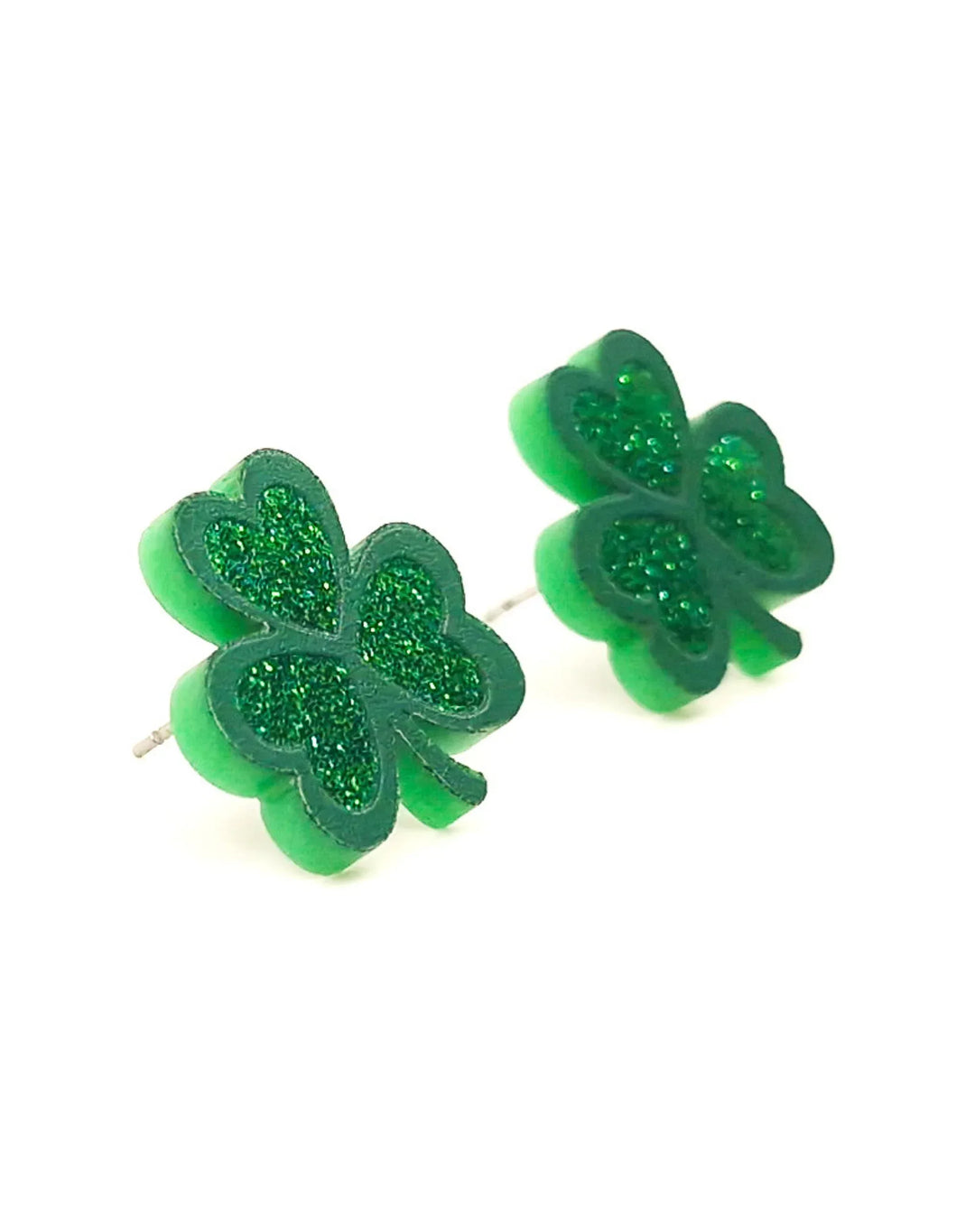 Side view of green shamrock glitter stud earrings highlighting thickness and stud post backing