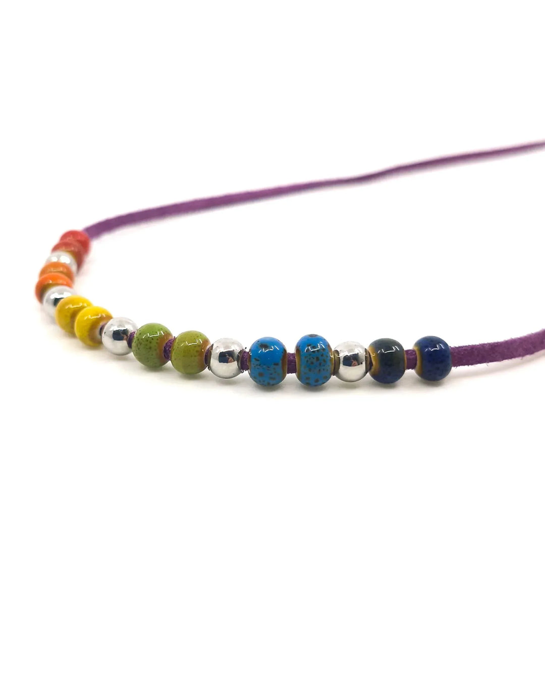 Close-up of rainbow ceramic beads on Rainbow Pride necklace