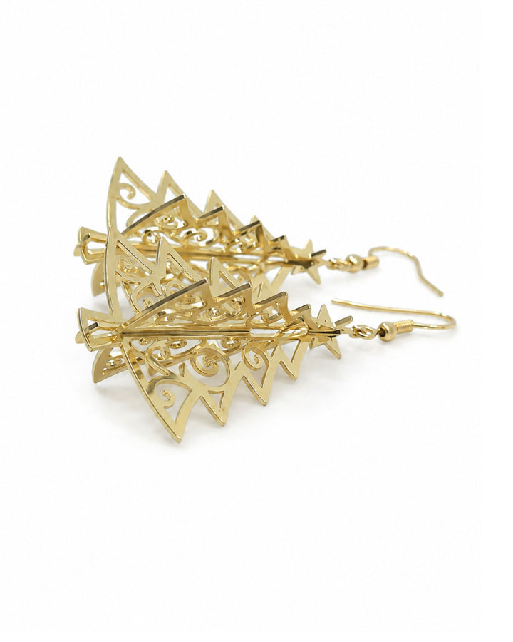 Side view of 3D gold Christmas tree earrings showing the crossed panels and depth