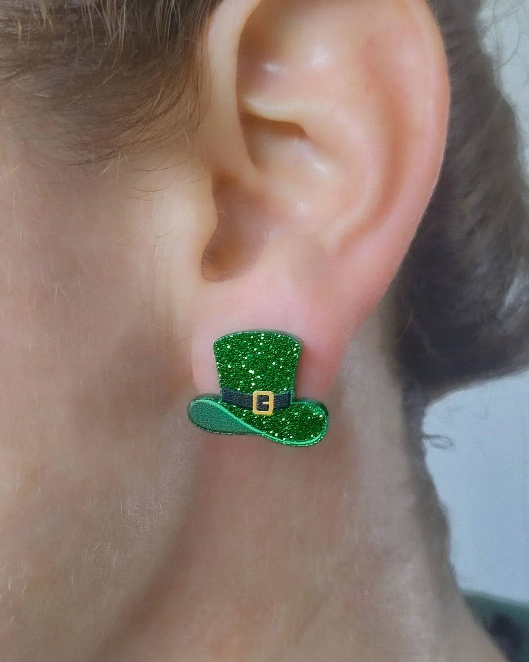 Leprechaun hat stud earring worn on ear to show size and sparkle