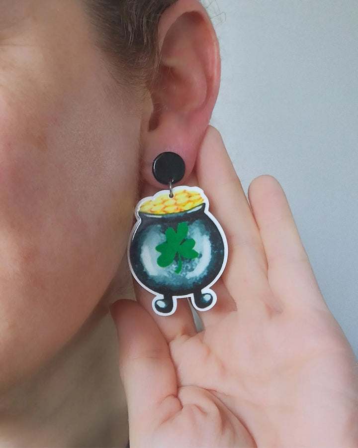 Lucky pot of gold drop earring worn on ear to show scale and movement