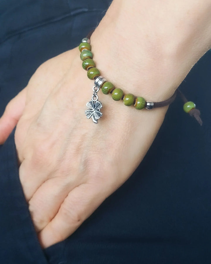 Shamrock charm bracelet worn on wrist showing size, fit and boho style