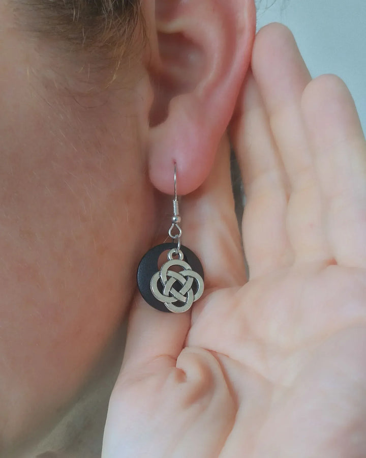 Celtic knot earrings worn on ear showing size and drop length