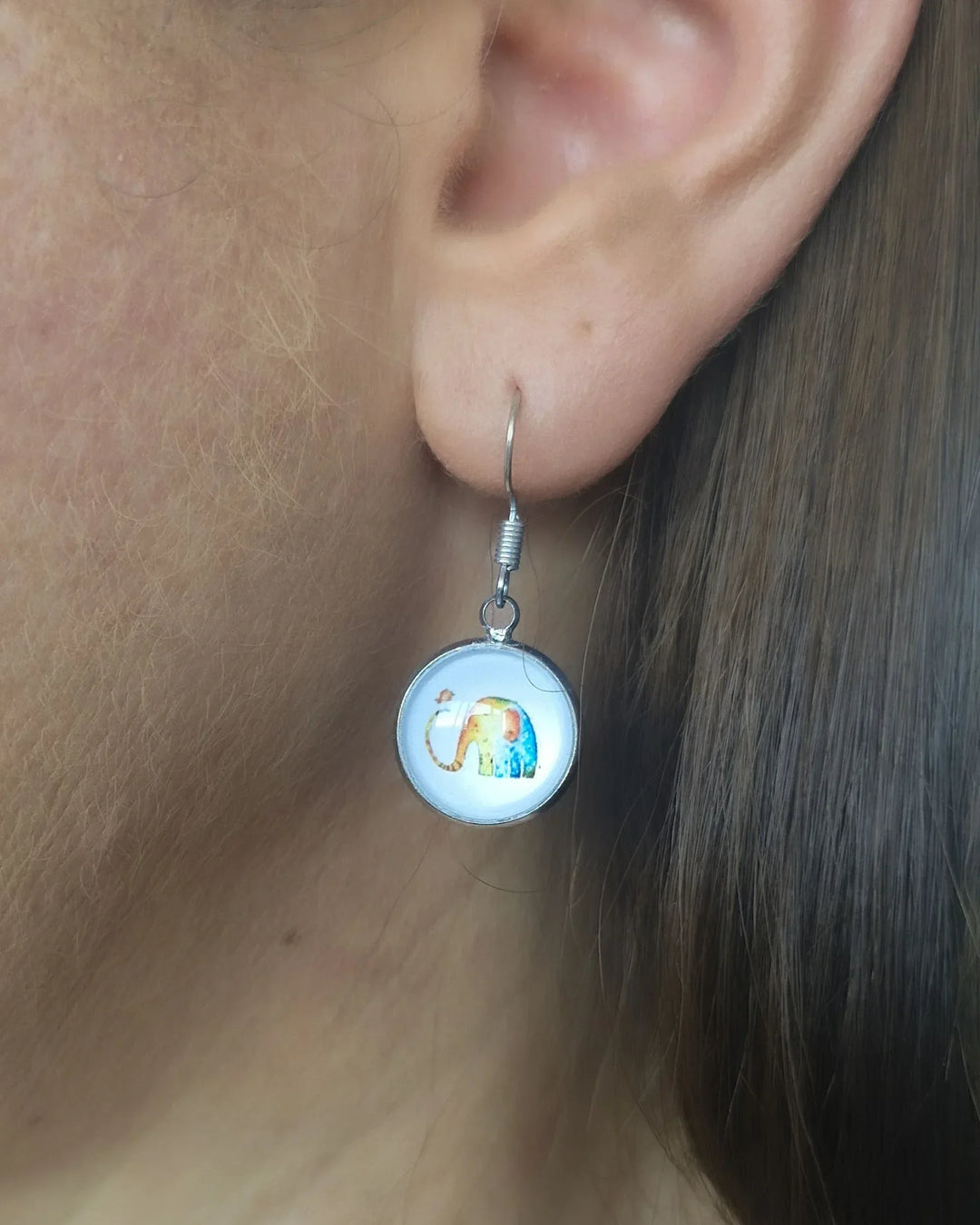 Rainbow Elephant Cabochon Drop Earring worn on ear, showing size and drop length