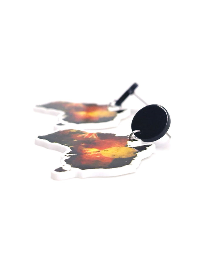 Close up showing detail of Australia map earrings featuring Indigenous inspired colours and Australian flag elements on stainless steel studs.