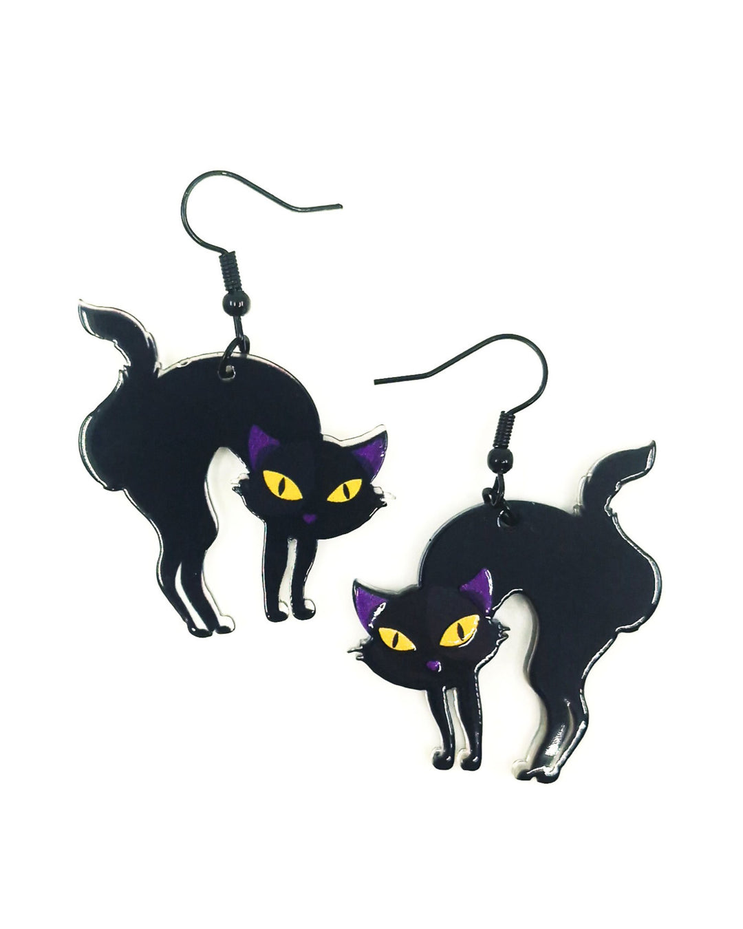 Black cat dangle earrings with arched backs, yellow eyes and black hooks on white background