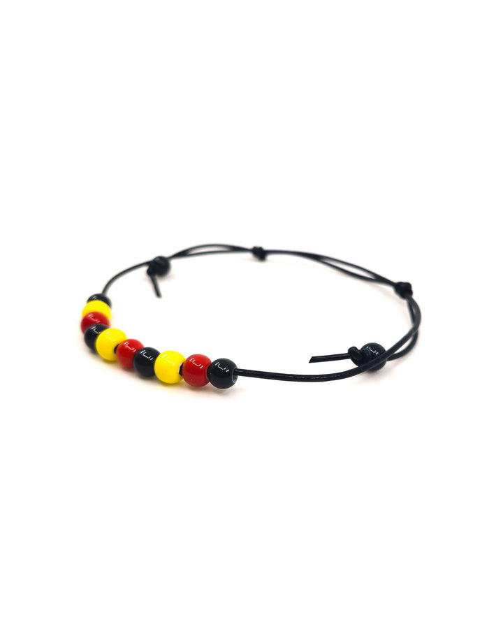 Close up view of Black Leather Indigenous, Red, Yellow &amp; Black Beaded Anklet Sunbaked Lizard Jewellery &amp; Gifts