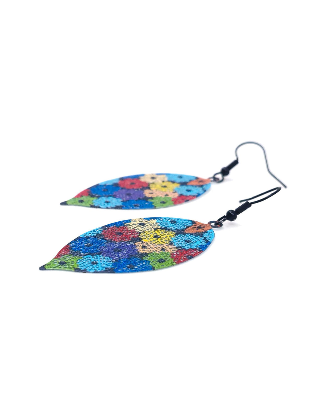 Colorful filigree floral-patterned earrings on a white background