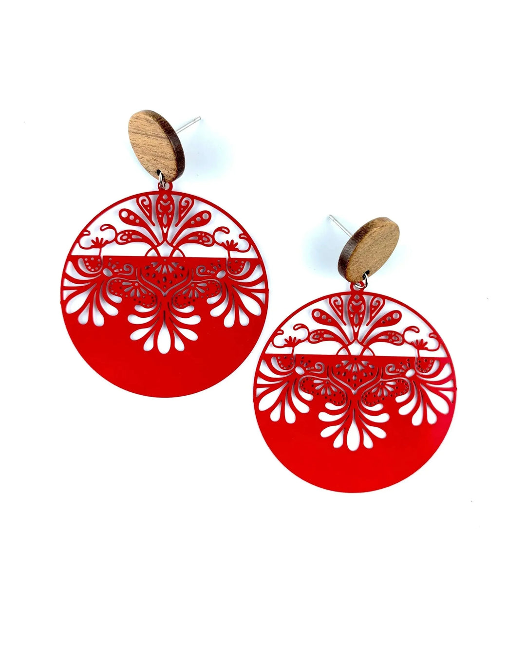Red lacey filigree round drop earrings with timber stud top and ornate cut-out detail on white background