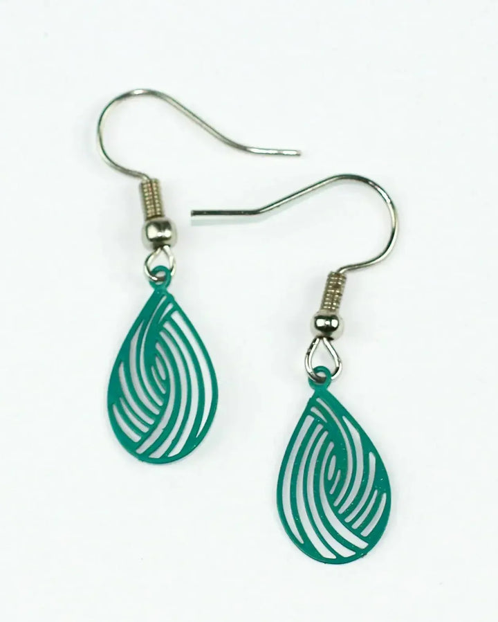 Pair of teal green filigree teardrop drop earrings with delicate cut-out swirl pattern and petite size