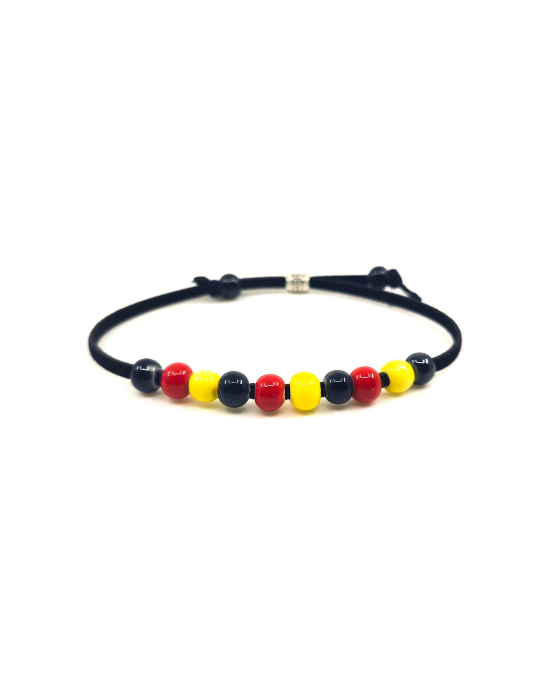 Indigenous inspired bracelet with red, yellow, and black ceramic beads on a white background