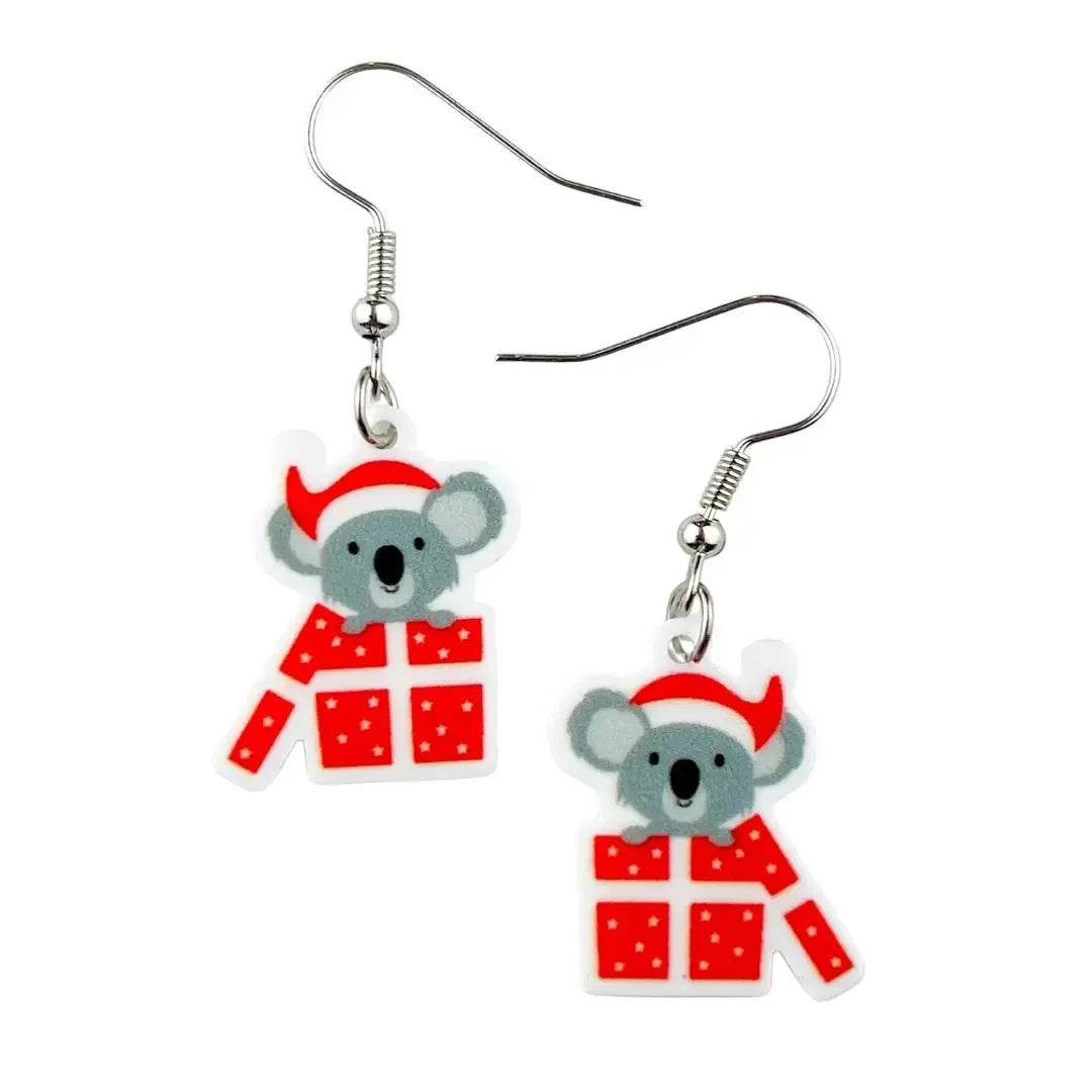 Koala Christmas Earrings - fun Aussie novelty drop earrings featuring koalas in Santa hats popping out of red gift boxes by Sunbaked Lizard.