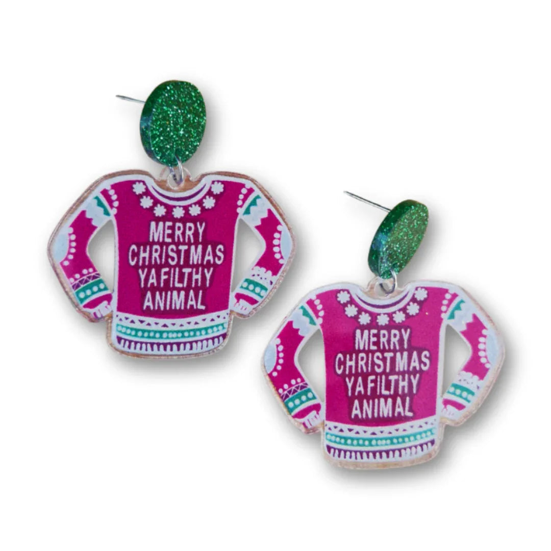 Earrings shaped like pink Christmas sweaters with text on a white background