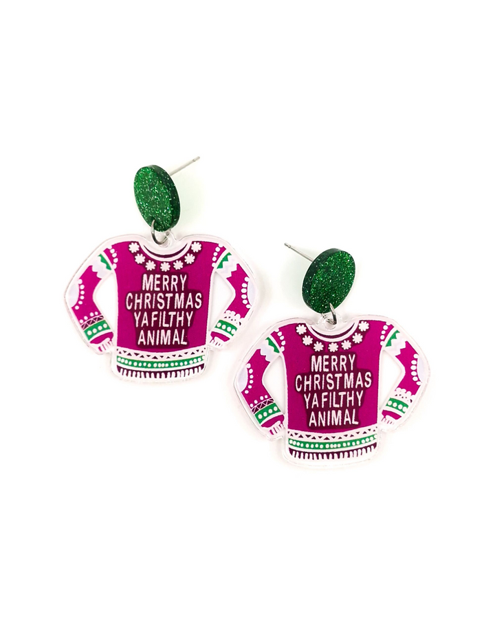 Earrings shaped like pink Christmas sweaters with text on a white background