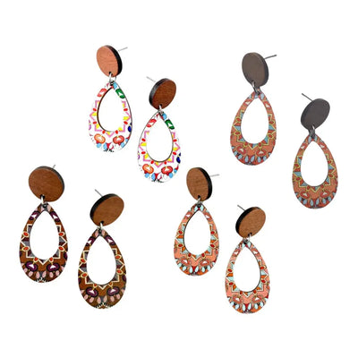 Set of colorful teardrop timber earrings on a white background
