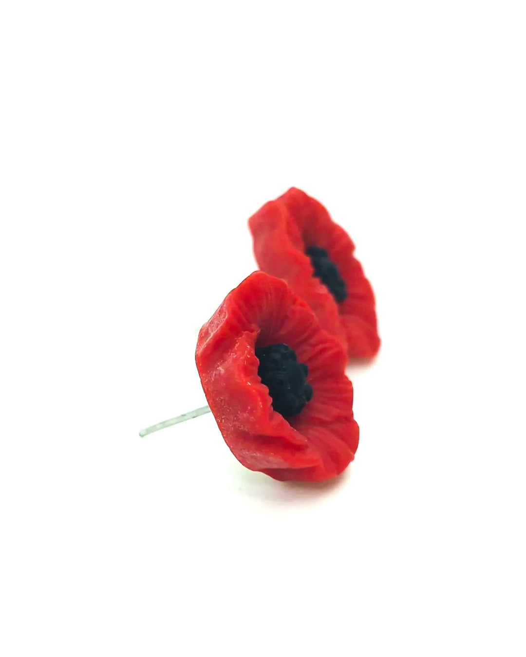 Side view of 17mm red poppy stud earrings on a white background