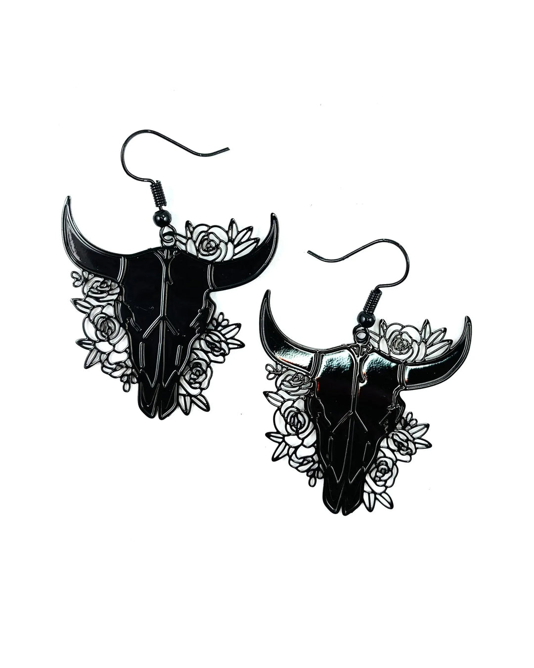 Black filigree bull skull drop earrings with rose cut-out detail on white background