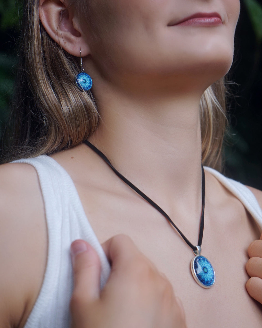 Model wearing the matching Blue Mandala jewellery set featuring a vibrant blue necklace and coordinating earrings.