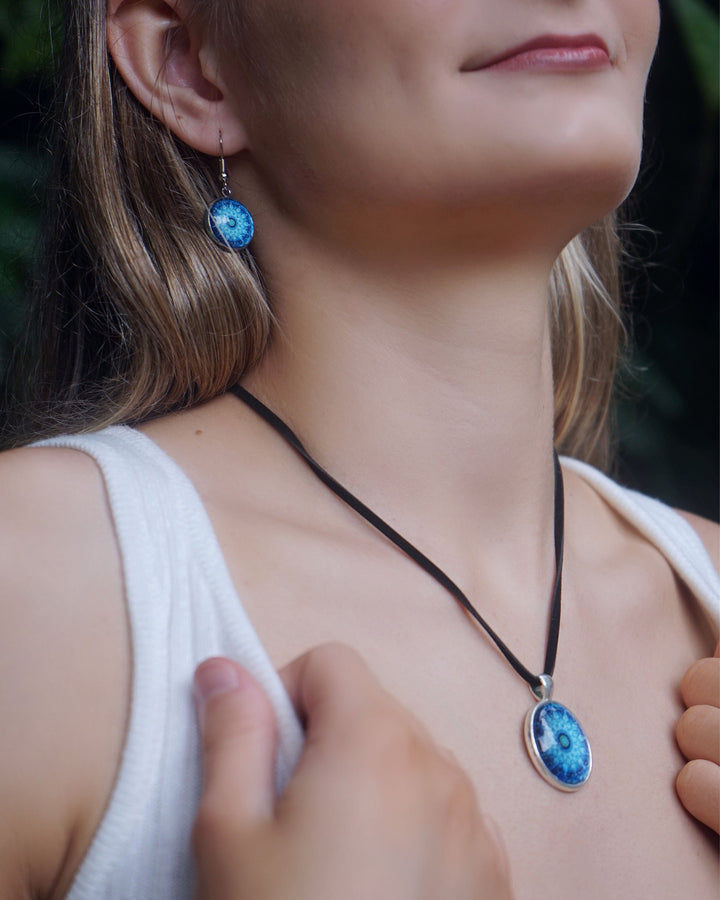 Model wearing the matching Blue Mandala jewellery set featuring a vibrant blue necklace and coordinating earrings.