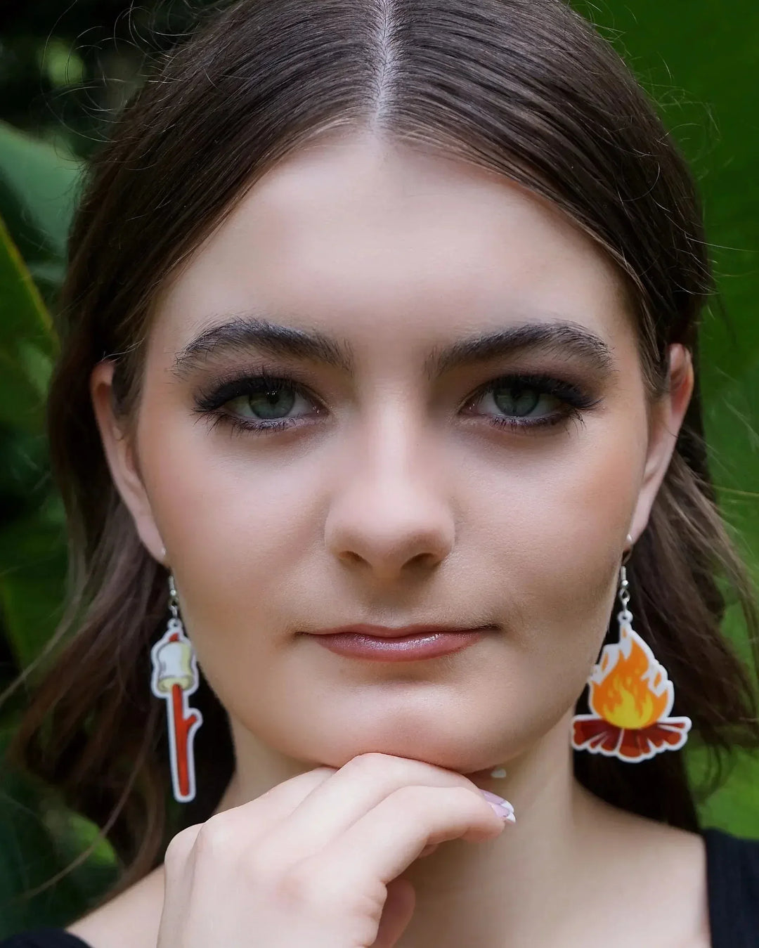 Front view of a model wearing the Marshmallows by the Campfire Dangle Earrings, showing both the marshmallow and campfire charms.
