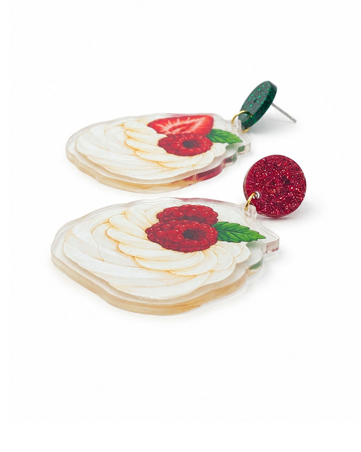 Side view of Christmas pavlova earrings showing the flat printed acrylic charm