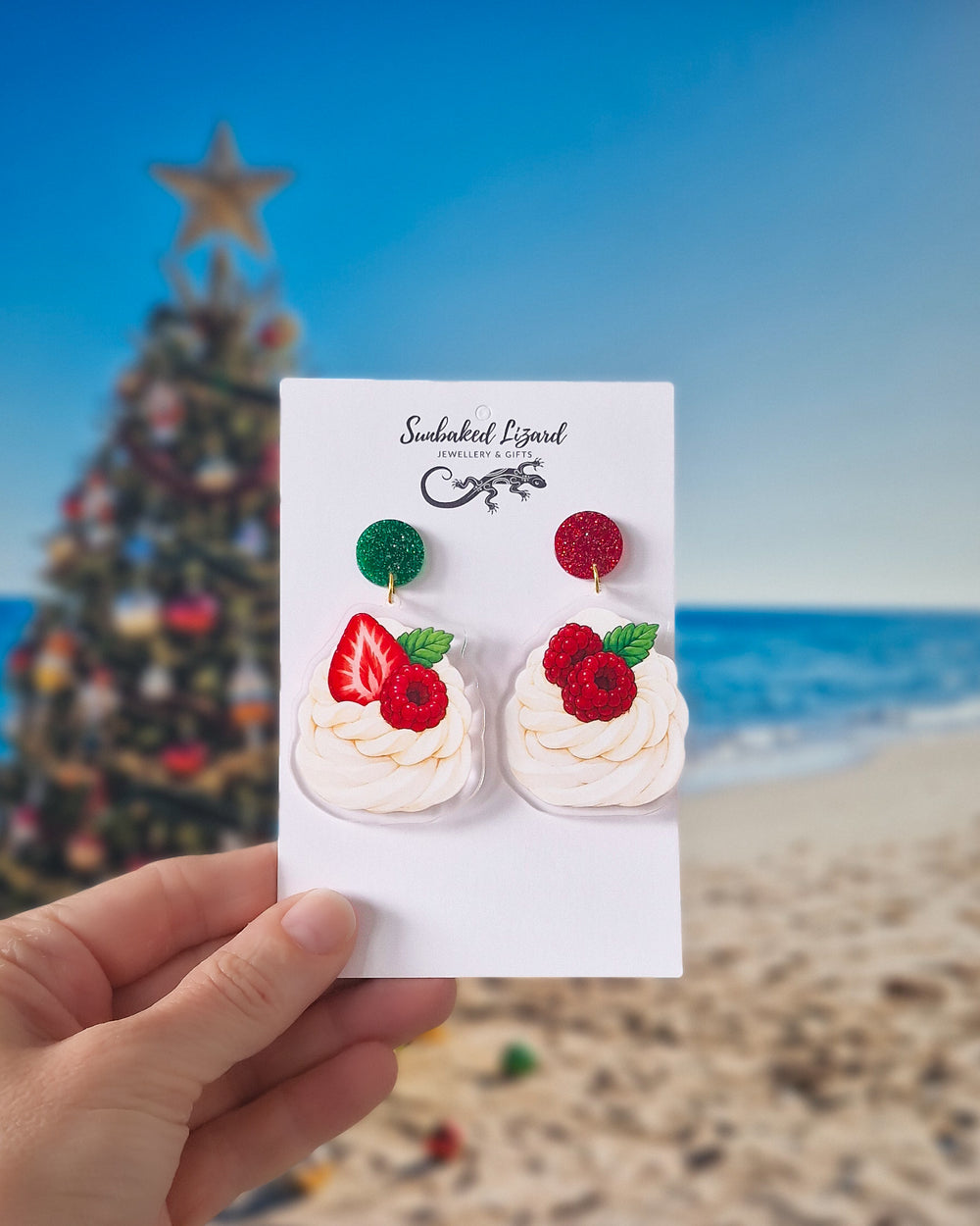 Christmas pavlova earrings with red and green glitter tops, cream pavlova shapes, berries and festive leaves.