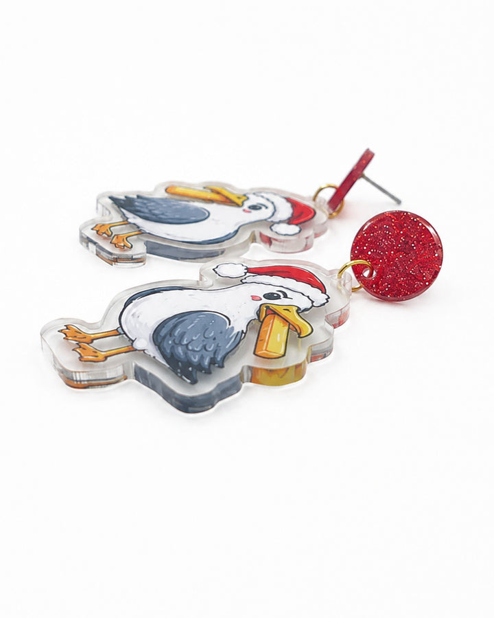 Side view of Christmas seagull earrings showing the flat printed acrylic charm