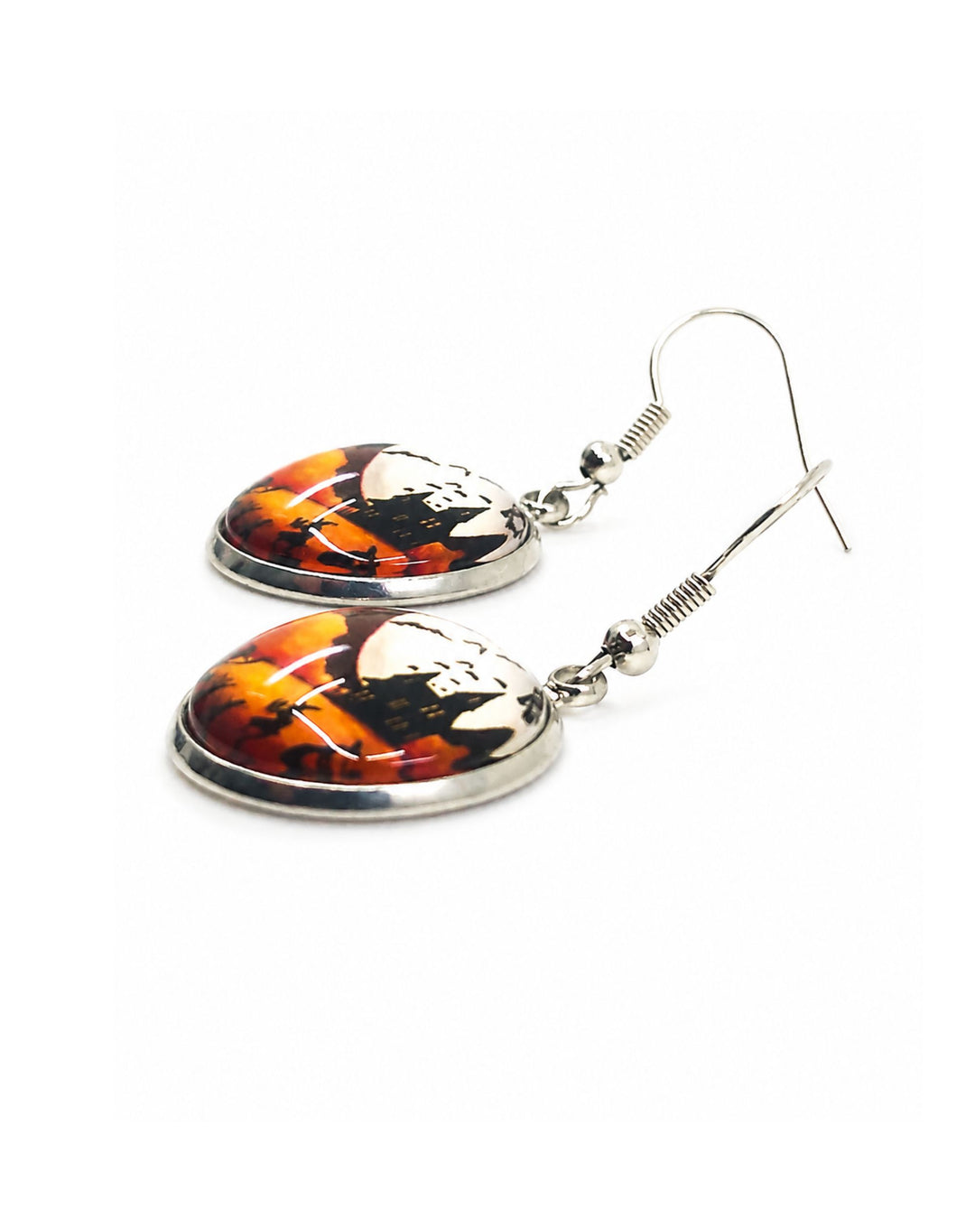 Close up of Dancing witches Halloween drop earrings showing full moon and hillside scene