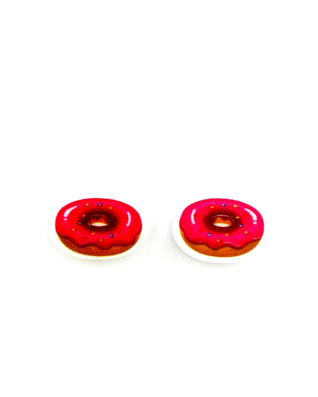 Pink iced donut stud earrings on Sunbaked Lizard display card