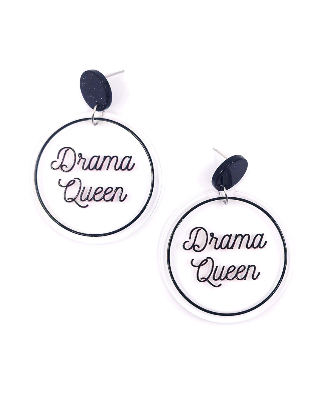 Drama Queen acrylic statement earrings with black lettering on clear round drops and black glitter studs.