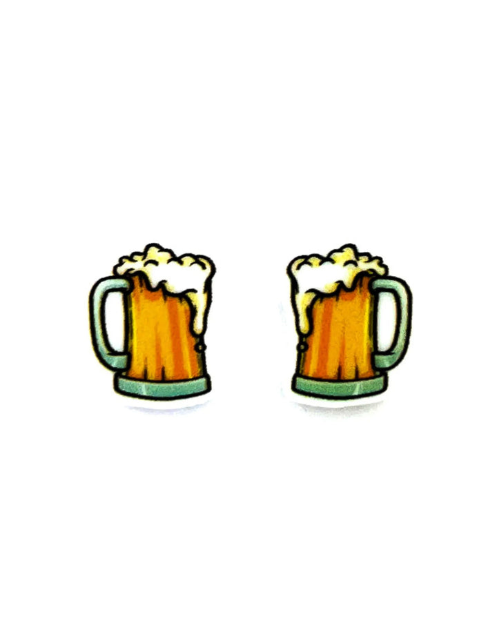 Beer stud earrings featuring a tiny 2D acrylic golden pint mug with white foam on a Sunbaked Lizard backing card.