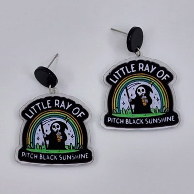 Little Ray of Pitch Black Sunshine Grim Reaper drop earrings in acrylic with rainbow design