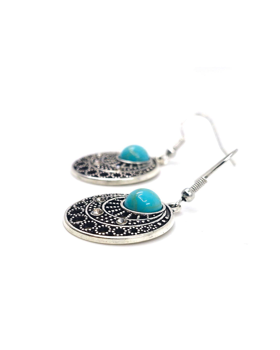 Side-on view of  Gypsy Turquoise Earrings on a white background highlighting texture.