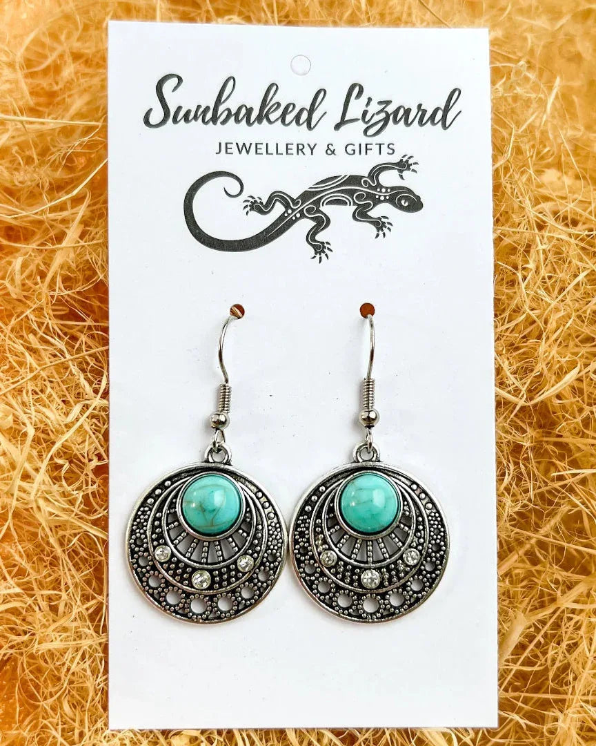 Gypsy Turquoise Earrings displayed on a Sunbaked Lizard branded backing card, ready for gifting.