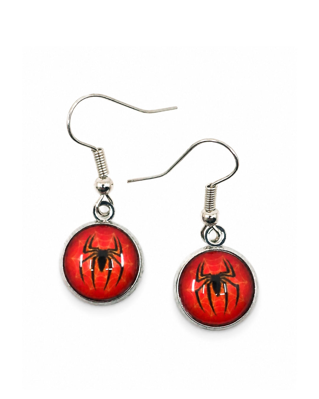Halloween spider drop earrings with glossy red cabochon pendants, black spider silhouettes and silver hook findings on a white background