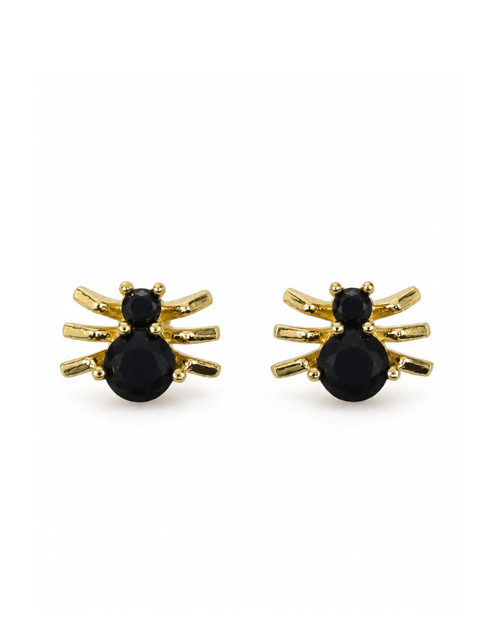 Close-up of black and gold spider stud earrings with faceted black stones on white background