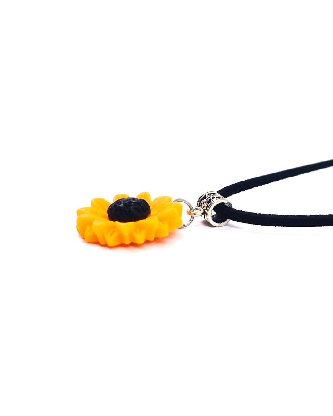 Detail view of sunflower pendant necklace with 25mm yellow charm and textured black centre